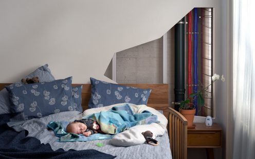 Master 3 Plus in wall while baby sleeping in bed